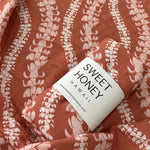 Brick Puakenikeni Lei Swaddle Blanket - Sweet Sweet Honey Hawaii