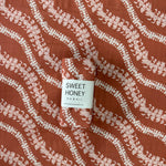 Brick Puakenikeni Lei Swaddle Blanket - Sweet Sweet Honey Hawaii